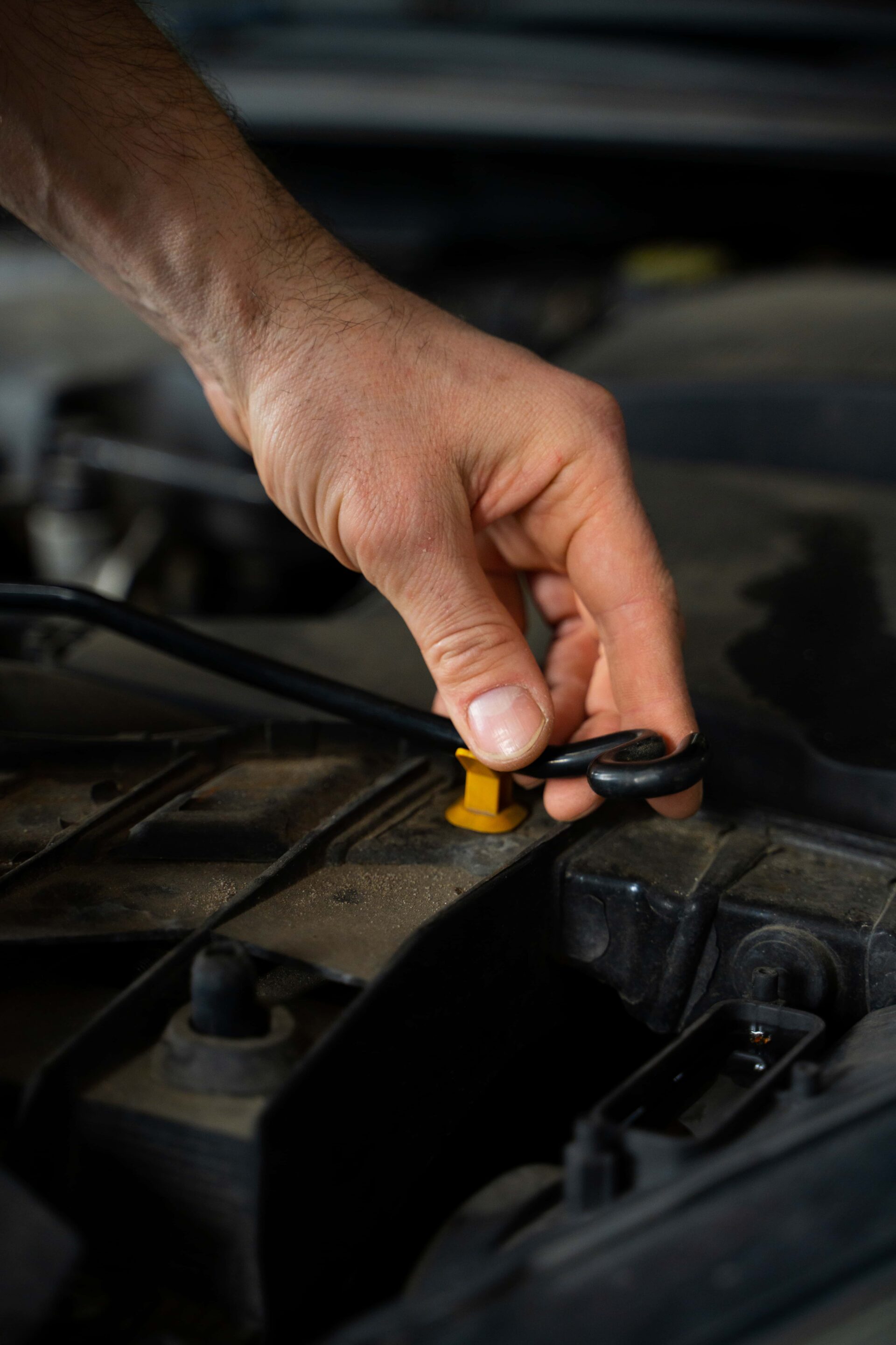 close-up-male-mechanic-working-auto-repair-shop-car (1)